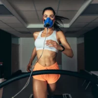 Girl running on treadmill doing vo2 max test