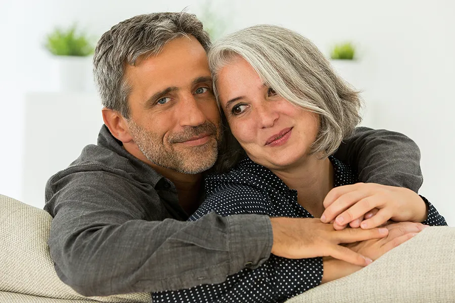 Lipidomic-Testing-Clinic A happy, healthy middle-aged couple on their couch. Get Lipidomic testing from Discovery Health Healing Center in Green Bay.