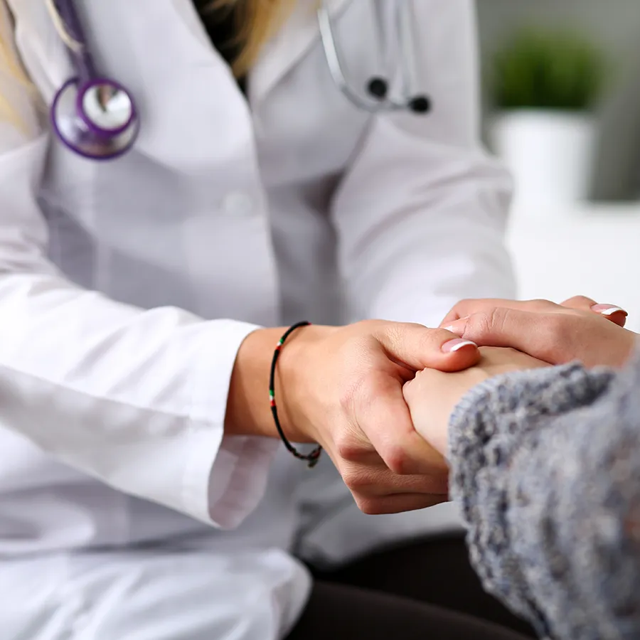 green-bay-functional-medicine-clinic functional medicine doctor holding the hand of a Green Bay patient